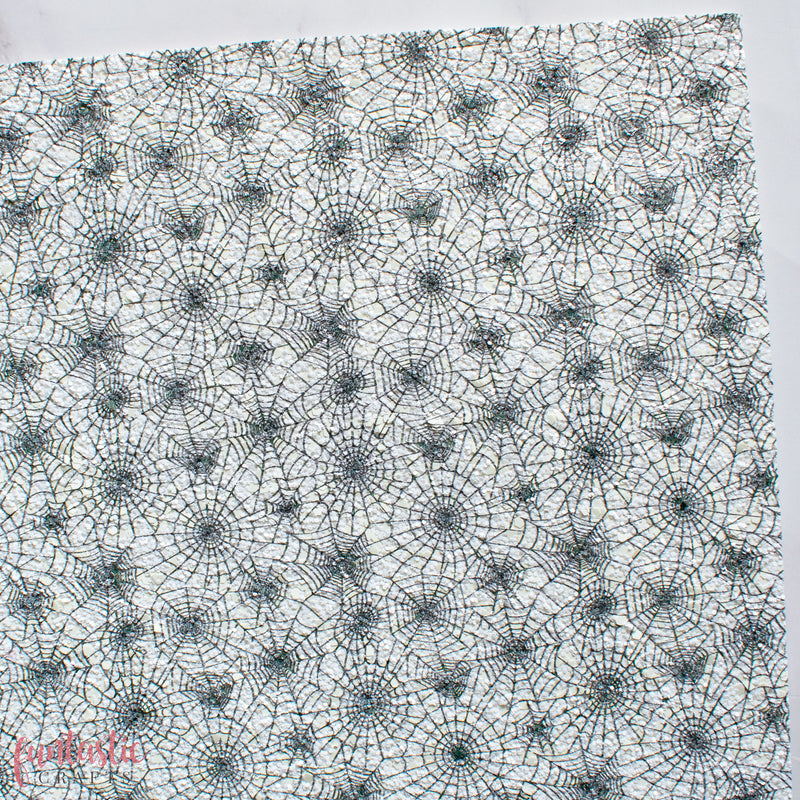 Cobwebs on White Halloween Chunky Glitter Fabric