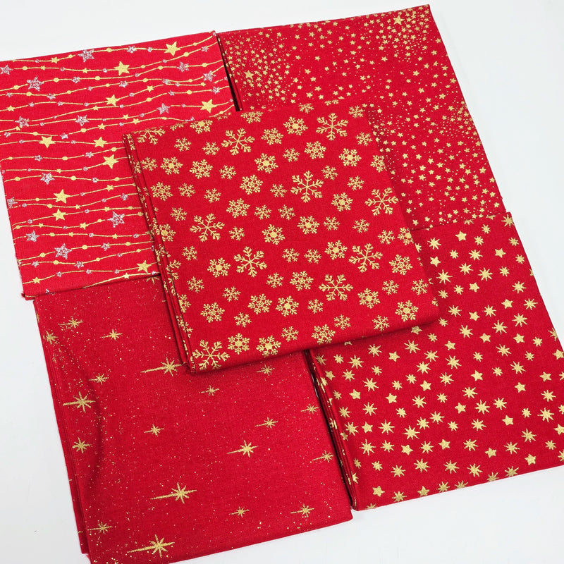 Red fabric swatches with gold star, snowflake, and line patterns on a white background