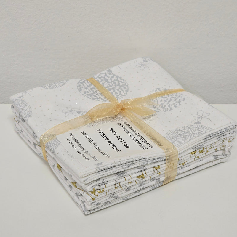 Packaged white and silver fabric with a label on a light gray background
