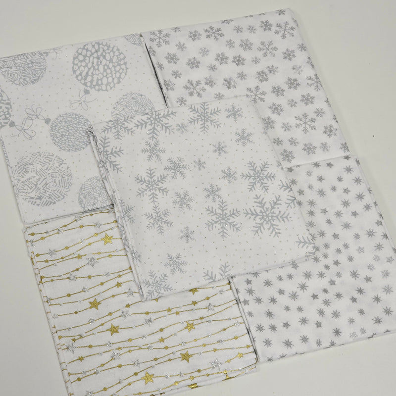 Folded fabric with snowflake and star pattern on a white background