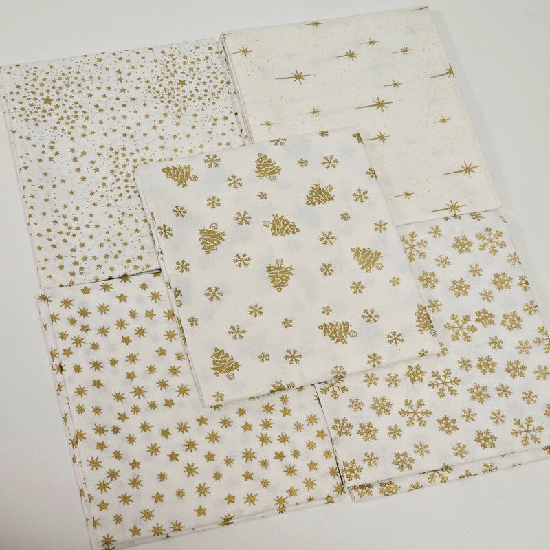 Set of gold star-patterned fabric pieces on a white background