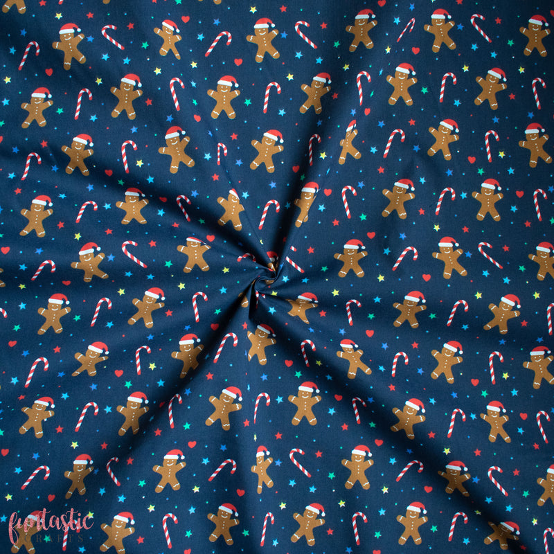 Gingerbread Men on Navy Polycotton Fabric