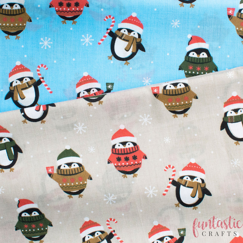Penguins in Christmas Jumpers on Blue Polycotton Fabric